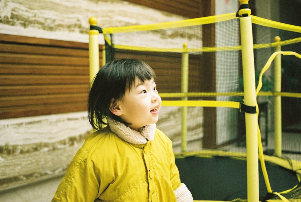 girl wearing yellow jacket