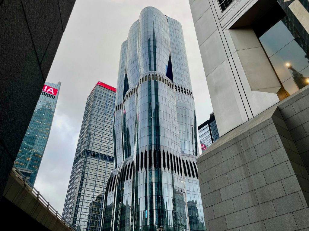Modern skyscrapers in a city under cloudy sky